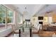 Elegant dining room with large windows and glass table is ideal for gatherings at 5590 Elk Knob Ct, Denver, NC 28037