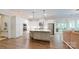 Modern kitchen with a center island, stainless steel appliances, and ample cabinet space at 5590 Elk Knob Ct, Denver, NC 28037