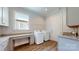Convenient laundry room with modern washer and dryer, plus granite countertops at 5590 Elk Knob Ct, Denver, NC 28037