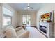 Cozy living room featuring an electric fireplace and backyard access at 5590 Elk Knob Ct, Denver, NC 28037