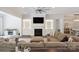 Cozy living room with a fireplace, built-in shelves, and a comfortable sectional sofa at 5590 Elk Knob Ct, Denver, NC 28037