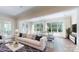Bright living room with large windows, modern furniture, and stylish decor at 5590 Elk Knob Ct, Denver, NC 28037