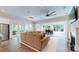 Bright living room with large windows, a comfortable sectional, and seamless indoor-outdoor transition at 5590 Elk Knob Ct, Denver, NC 28037
