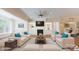 Spacious living room with fireplace, built-in cabinets, and large windows for ample natural light at 5590 Elk Knob Ct, Denver, NC 28037