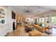 Inviting living room featuring a fireplace, open kitchen, and dining area for a connected living space at 5590 Elk Knob Ct, Denver, NC 28037