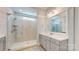 Bathroom featuring a double vanity with a glass shower at 5590 Elk Knob Ct, Denver, NC 28037