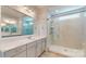 Main bathroom featuring double vanity sinks and a glass shower at 5590 Elk Knob Ct, Denver, NC 28037