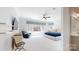Spacious main bedroom with a large window, ceiling fan and sitting area at 5590 Elk Knob Ct, Denver, NC 28037
