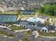An aerial shows the community with tennis courts, a pool, and a clubhouse at 6015 Waldorf Ave, Monroe, NC 28110