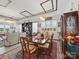 Formal dining room with elegant furnishings, including a chandelier and a large wooden table at 6015 Waldorf Ave, Monroe, NC 28110