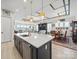Open kitchen island flows into a formal living and dining area in this spacious home at 6015 Waldorf Ave, Monroe, NC 28110