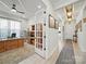 Spacious office with wood desk, and bright hallway with decorative chandeliers at 6015 Waldorf Ave, Monroe, NC 28110