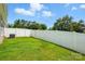 Backyard with lush grass and a white fence, offering a serene outdoor retreat at 6333 Cory Bret Ln, Charlotte, NC 28278