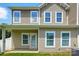 Exterior of home with windows, back door, and a view of the yard, showcasing the outdoor space at 6333 Cory Bret Ln, Charlotte, NC 28278