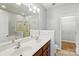 Bathroom features a double sink vanity, large mirror, separate shower and toilet area at 6333 Cory Bret Ln, Charlotte, NC 28278