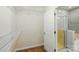 View into the bathroom from the walk-in closet, with a shower and tub combination at 6333 Cory Bret Ln, Charlotte, NC 28278