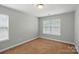 The bedroom has carpet flooring and a large window at 6333 Cory Bret Ln, Charlotte, NC 28278