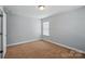 Bedroom with carpet floor and a window at 6333 Cory Bret Ln, Charlotte, NC 28278