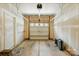 Garage with a white door, unfinished walls, and a concrete floor at 6333 Cory Bret Ln, Charlotte, NC 28278