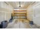 Garage with shelves and exposed drywall at 6333 Cory Bret Ln, Charlotte, NC 28278