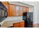 Close-up of kitchen cabinets, backsplash, stainless steel appliances including a built in microwave at 6333 Cory Bret Ln, Charlotte, NC 28278