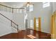 Spacious living room boasting high ceilings, hardwood floors, and large windows allowing abundant natural light at 6333 Cory Bret Ln, Charlotte, NC 28278