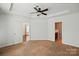 Large main bedroom includes tray ceiling, ceiling fan, and access to a private bath at 6333 Cory Bret Ln, Charlotte, NC 28278