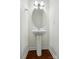 Powder room features a pedestal sink, round mirror, and classic design at 6333 Cory Bret Ln, Charlotte, NC 28278