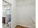 View from a bathroom into the walk-in closet with wire shelving at 6333 Cory Bret Ln, Charlotte, NC 28278