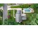 Overhead view of the home with a swimming pool, patio, and well-maintained garden in a lush environment at 6745 Wheeler Dr, Charlotte, NC 28211
