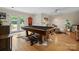 Entertaining game room featuring a pool table, stylish decor, and access to the outdoors at 6745 Wheeler Dr, Charlotte, NC 28211