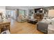 Inviting living room with hardwood floors, a cozy fireplace, and built-in shelving for a relaxing ambiance at 6745 Wheeler Dr, Charlotte, NC 28211