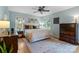 Bright and airy main bedroom with natural light, hardwood floors, and decorative accents at 6745 Wheeler Dr, Charlotte, NC 28211