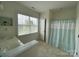 The bathroom with a tub and double sinks at 707 Five Leaf Ln, Waxhaw, NC 28173