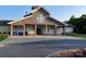 Community clubhouse featuring stone accents, a welcoming entrance, and convenient parking for residents at 707 Five Leaf Ln, Waxhaw, NC 28173