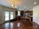Open kitchen with island, granite countertops, and stainless steel appliances at 707 Five Leaf Ln, Waxhaw, NC 28173