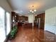 Eat-in kitchen features stainless appliances, granite countertops, and wood cabinets at 707 Five Leaf Ln, Waxhaw, NC 28173