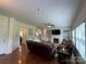 Living room with a fireplace, a TV, and hardwood floors at 707 Five Leaf Ln, Waxhaw, NC 28173