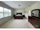 Spacious primary bedroom with natural light and a dresser at 707 Five Leaf Ln, Waxhaw, NC 28173