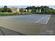 Well-maintained tennis court with green surroundings, offering a great recreational amenity for residents at 707 Five Leaf Ln, Waxhaw, NC 28173