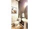 Chic powder room showcasing stylish wallpaper, a pedestal sink, and modern fixtures at 7170 Kenyon Dr, Denver, NC 28037