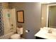 Well-lit bathroom featuring a shower-tub, vanity, and modern fixtures at 7170 Kenyon Dr, Denver, NC 28037