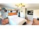 Bedroom featuring natural light, a wooden headboard bed frame, and decor shelving at 7170 Kenyon Dr, Denver, NC 28037