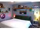 The bedroom features custom decor and lots of sports themed decorations at 7170 Kenyon Dr, Denver, NC 28037