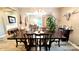 Elegant dining room featuring a large table, ornate chandelier, and stylish decor at 7170 Kenyon Dr, Denver, NC 28037