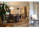 Dining room featuring an elegant chandelier and hardwood floors, with an open layout to the staircase at 7170 Kenyon Dr, Denver, NC 28037