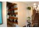 Dining area with pot rack on the wall leading into the kitchen and views of the staircase at 7170 Kenyon Dr, Denver, NC 28037