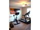 Bright home exercise room with a treadmill and stationary bike for a complete workout at 7170 Kenyon Dr, Denver, NC 28037
