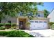 Charming home with a two-car garage, manicured lawn, and attractive landscaping at 7170 Kenyon Dr, Denver, NC 28037