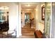 Inviting hallway with hardwood floors, neutral paint, and staircase leading to upper level at 7170 Kenyon Dr, Denver, NC 28037